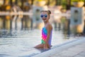 Portrait of cute happy little girl having fun in swimming pool. Royalty Free Stock Photo