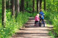 Kids sport - little boy and girl riding bikes in forest Royalty Free Stock Photo