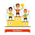 Kids sport winners standing on podium