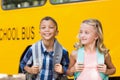 Kids standing in front of school bus Royalty Free Stock Photo