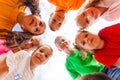 Kids standing together in circle looking at the camera Royalty Free Stock Photo