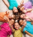 Kids in star shape laying on the florr Royalty Free Stock Photo