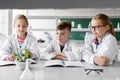 Kids or students with plant at biology class Royalty Free Stock Photo