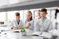 Kids or students with plant at biology class Royalty Free Stock Photo