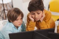 Kids studying together at computer school