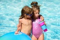 Kids summer weekend holidays. Summertime vacation. Couple of children in swimming pool. Royalty Free Stock Photo