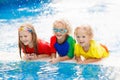 Kids in swimming pool. Children swim. Family fun Royalty Free Stock Photo