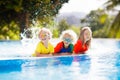 Kids in swimming pool. Children swim. Family fun Royalty Free Stock Photo