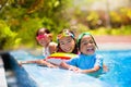 Kids in swimming pool. Children swim. Family fun Royalty Free Stock Photo