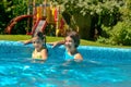 Kids in swimming pool have fun in water, children on family vacation