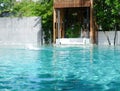 Kids in swimming suit play and swim in water pool in resort Royalty Free Stock Photo