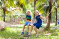 Kids on swing. Playground in tropical resort Royalty Free Stock Photo