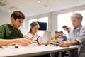 Kids with tablet pc programming at robotics school Royalty Free Stock Photo