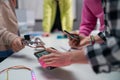 Kids with teacher working together on project with electric toys and robots at robotics classroom, close-up Royalty Free Stock Photo