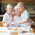 Kids teaching grandma to use tablet pc