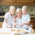 Kids teaching grandma to use tablet pc