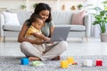 Kids And Technology. Black Mom And Little Baby Using Laptop At Home Royalty Free Stock Photo