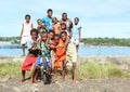 Kids and teens posing on bank of sea in Manokwari