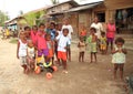 Kids and teens posing in village in Sorong