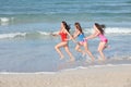Kids, teens running on beach vacation Royalty Free Stock Photo