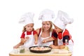 Kids and their mother preparing a pizza Royalty Free Stock Photo