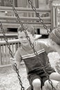 Kids on tire swing