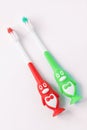 Kids toothbrushes in a shape of penguins on a white background isolated. Funny teaching children to easy brush teeth