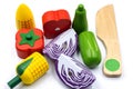 Kids toy wooden vegetables in white background close up. Childrens set of wooden vegetables
