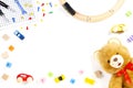 Kids toys background with teddy bear, toy train, cars and colorful bricks Royalty Free Stock Photo