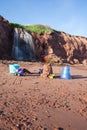 Kids Toys on Beach with Waterfall