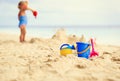 Kids toys and little girl building sandcastle