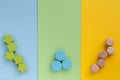 Kids toys on pastel yellow blue green paper background. Top view on children`s educational games. Wooden stars circles cubes. Fla Royalty Free Stock Photo