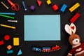 Kids toys, stationery on dark background with copy space Royalty Free Stock Photo