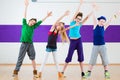 Kids train Zumba fitness in dancing school Royalty Free Stock Photo