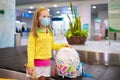 Kids travel and fly. Child at airplane in airport