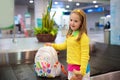 Kids travel and fly. Child at airplane in airport Royalty Free Stock Photo