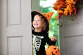 Kids trick or treat. Halloween. Child at door Royalty Free Stock Photo