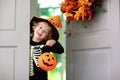 Kids trick or treat. Halloween. Child at door Royalty Free Stock Photo