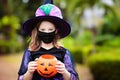 Kids trick or treat. Halloween in face mask Royalty Free Stock Photo