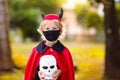 Kids trick or treat. Halloween in face mask Royalty Free Stock Photo