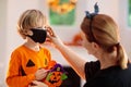 Kids trick or treat. Halloween in face mask Royalty Free Stock Photo