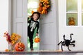 Kids trick or treat. Halloween. Child at door