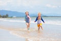 Kids on tropical beach. Children playing at sea Royalty Free Stock Photo