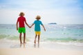 Kids on tropical beach. Children playing at sea Royalty Free Stock Photo