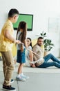 kids tying parents with rope on floor