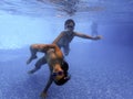 Kids underwater in the pool Royalty Free Stock Photo