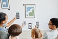 Kids Using Smartphones in Art Gallery