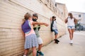 Kids waiting outside school for the door to be opened during Coronavirus pandemic Royalty Free Stock Photo