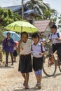 Kids walking around the streets of Vang Vieng