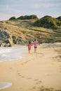 Kids walking on the beach